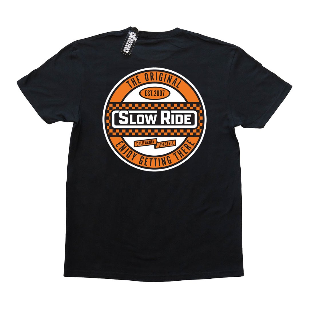 Checkered Tee (4 Colors) - Slow Ride Bold Slow Ride t-shirt featuring an eye-catching circular logo with a checkered design in orange and black, celebrating the vintage Volkswagen lifestyle. This black slow ride shirt is perfect for enthusiasts of the Volkswagen bus, Volkswagen bug, and Baja bug, blending Off-Roading and Off-Road Racing culture with a classic, laid-back vibe. Ideal for those who appreciate the thrill of the journey and the timeless appeal of vintage Volkswagen vehicles.