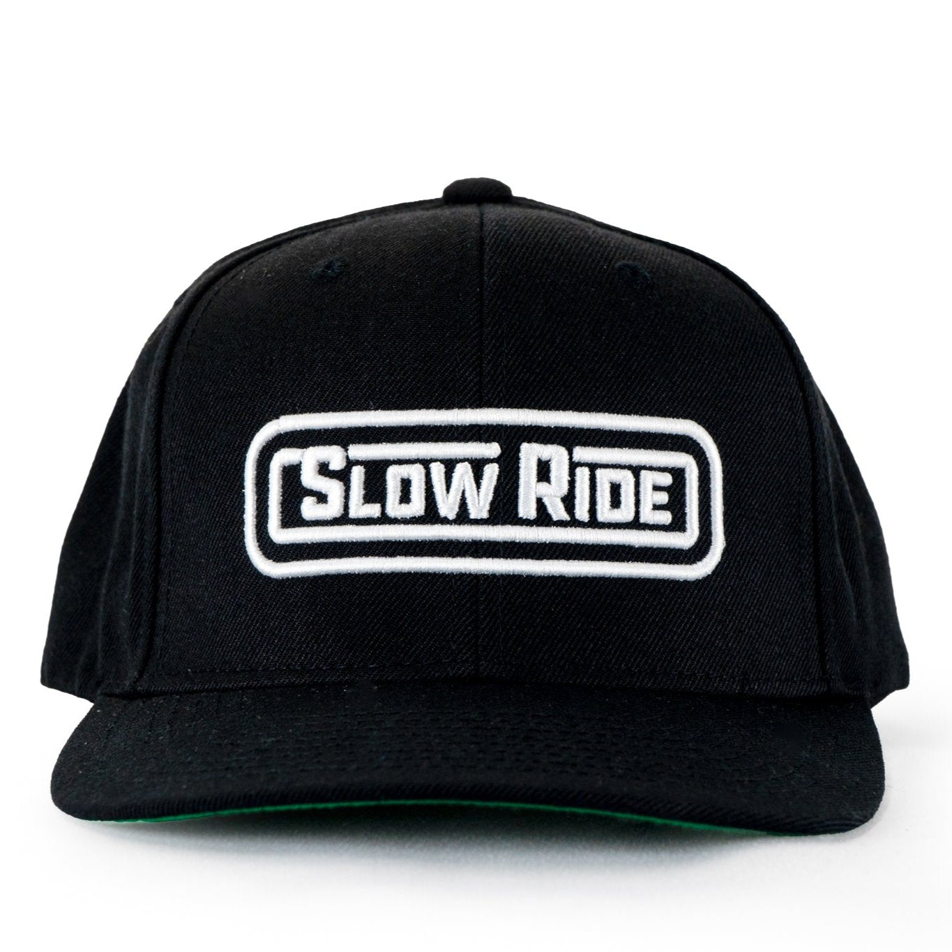 Radio Hat (Black) - Slow Ride- Classic black snapback hat featuring the 'Slow Ride' logo embroidered in white on the front. Perfect for fans of Off-Roading, Off-Road Racing, and vintage Volkswagen culture, including the iconic Volkswagen bus, Volkswagen bug, and Baja bug. This hat is ideal for those who embrace the Garage and Racing lifestyle and live by mottos like 'Enjoy Getting There,' 'Wheelin and Spilling,' and 'Restore and Destroy.' A must-have accessory for blue-collar workwear enthusiasts and racing