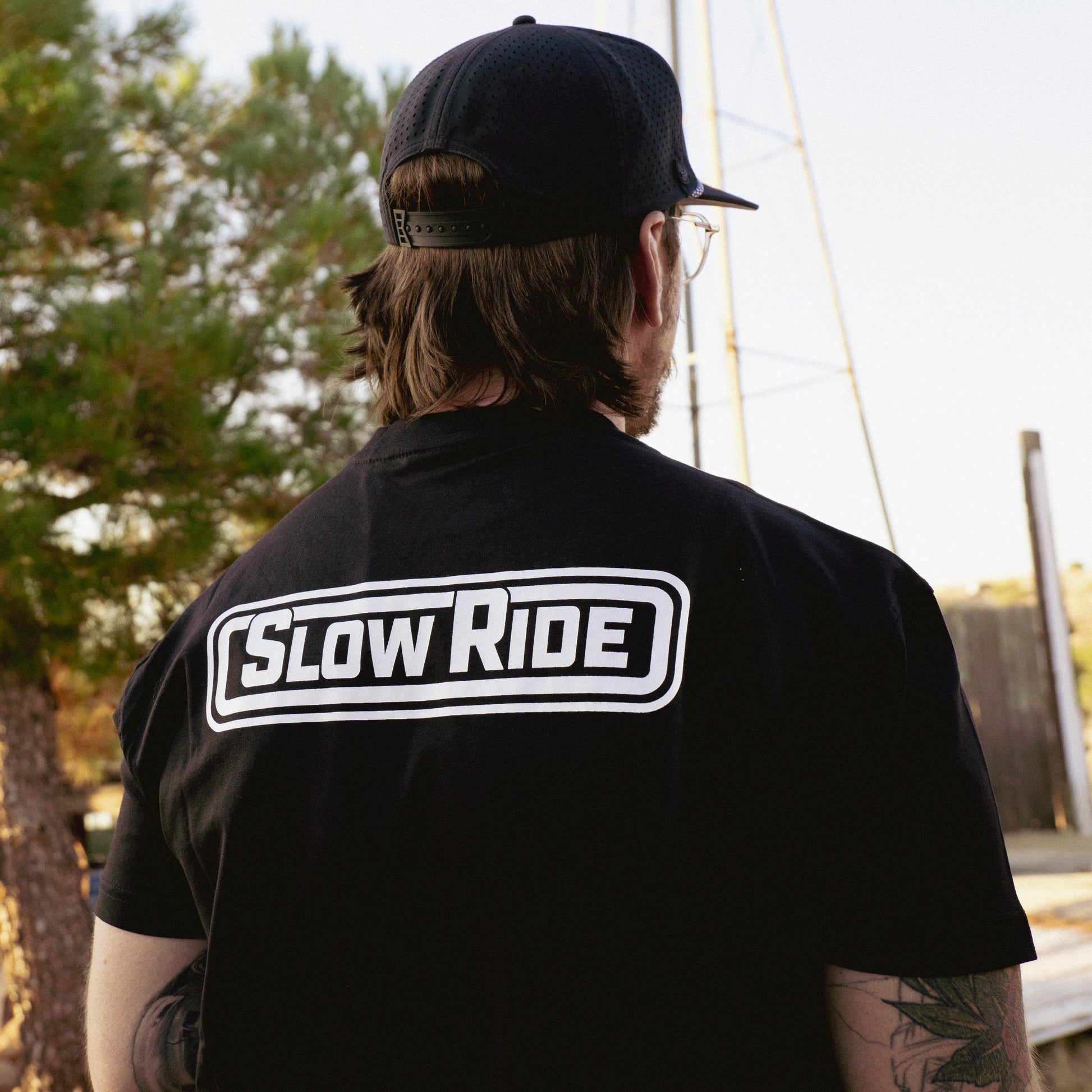 Radio Heavyweight Tee (Black) - Slow Ride- Classic Slow Ride t-shirt available in black and gray, featuring the iconic 'Slow Ride' logo on the back. Ideal for fans of Off-Roading and Off-Road Racing, this slow ride shirt celebrates the vintage Volkswagen culture, including the Volkswagen bus, Volkswagen bug, and Baja bug. Perfect for those who embrace the Garage and Racing lifestyle and live by mottos like 'Enjoy Getting There,' 'Wheelin and Spilling,' and 'Restore and Destroy.' A must-have for blue-collar 