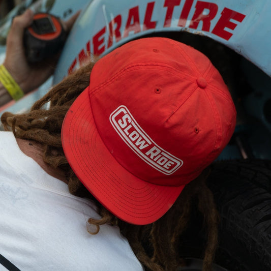 Radio Surf Hat (4 Colors) - Slow Ride- Slow Ride nylon surf hat in vibrant colors, perfect for off-roading adventures and beach days. Features bold 'Slow Ride' logo, ideal for Volkswagen bus enthusiasts and vintage Volkswagen fans. Great for off-road racing, Baja bug lovers, and those who embrace the Garage and Racing lifestyle. Embody the spirit of 'Enjoy Getting There' with this blue-collar, workwear-inspired accessory. Whether you're wheelin’ and spilling or restoring and destroying, this hat is your go-
