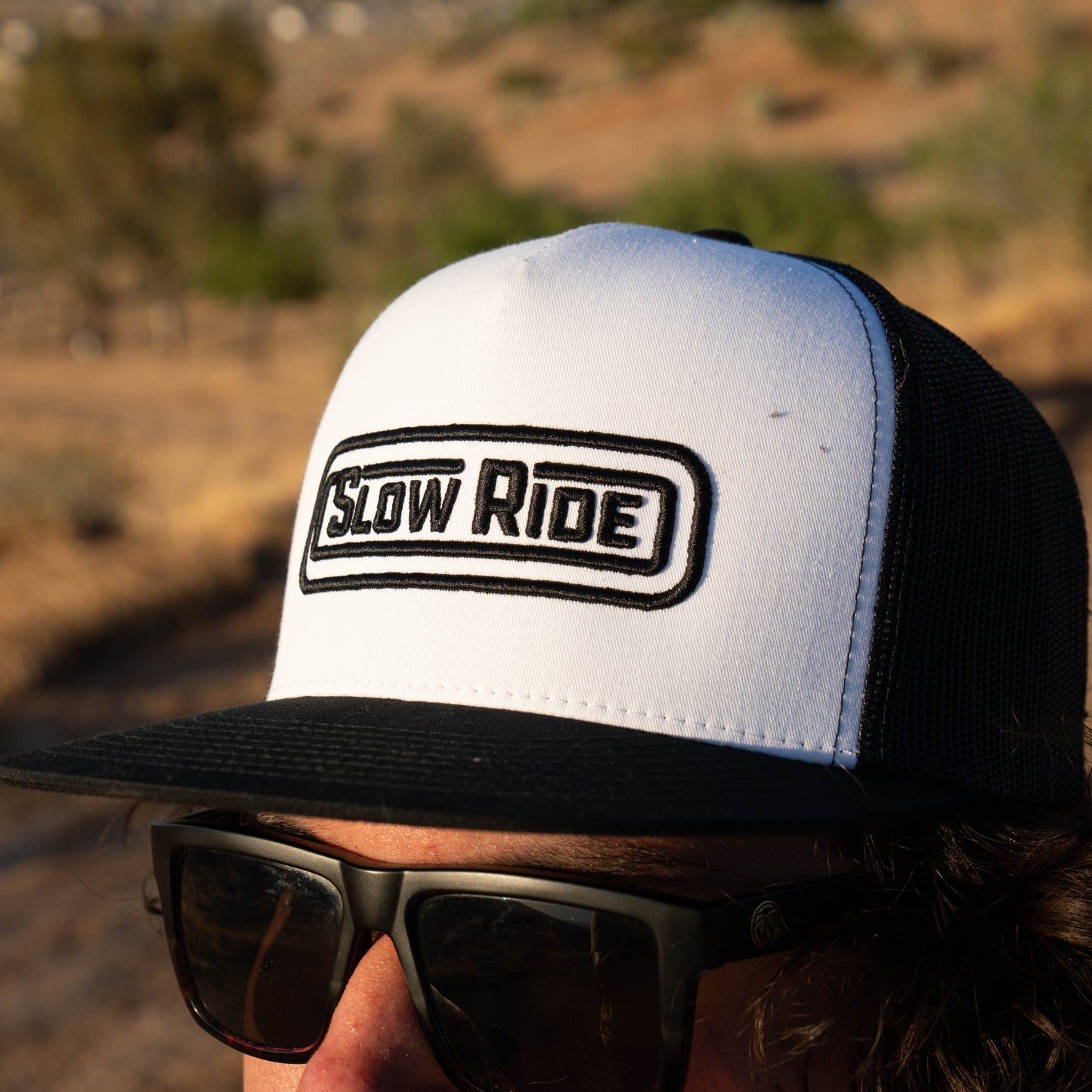Radio Trucker Hat (White/Black) - Slow Ride Black/white Slow Ride mesh trucker hat for vintage Volkswagen, off-roading, racing, and blue-collar workwear. Perfect for Baja bug fans
